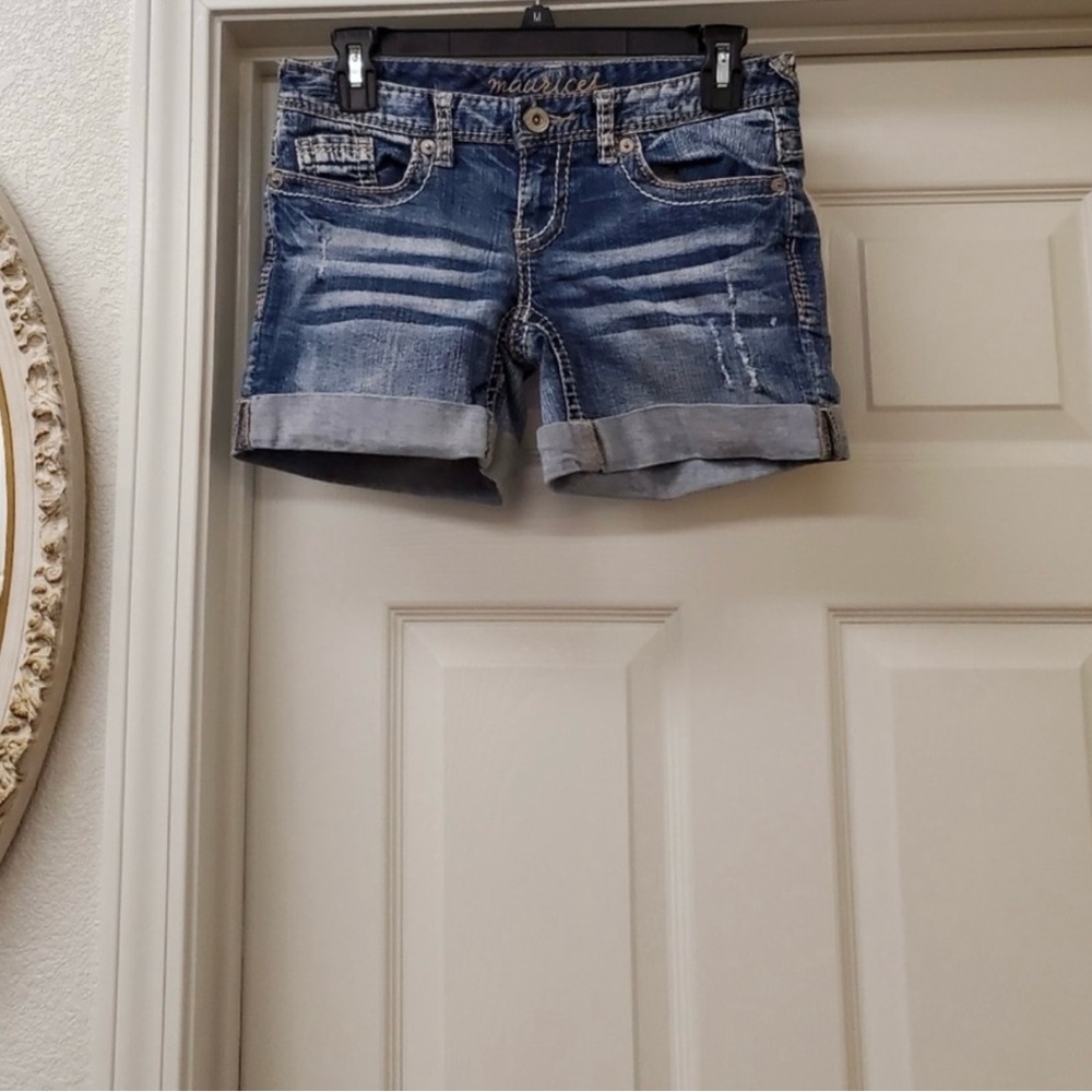 Maurice Distressed Blue Jean Shorts are a size 1/2.
